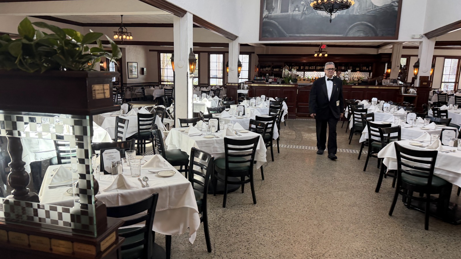 White-tablecloth main dining room inside Joe's Stone Crab in Miami Beach