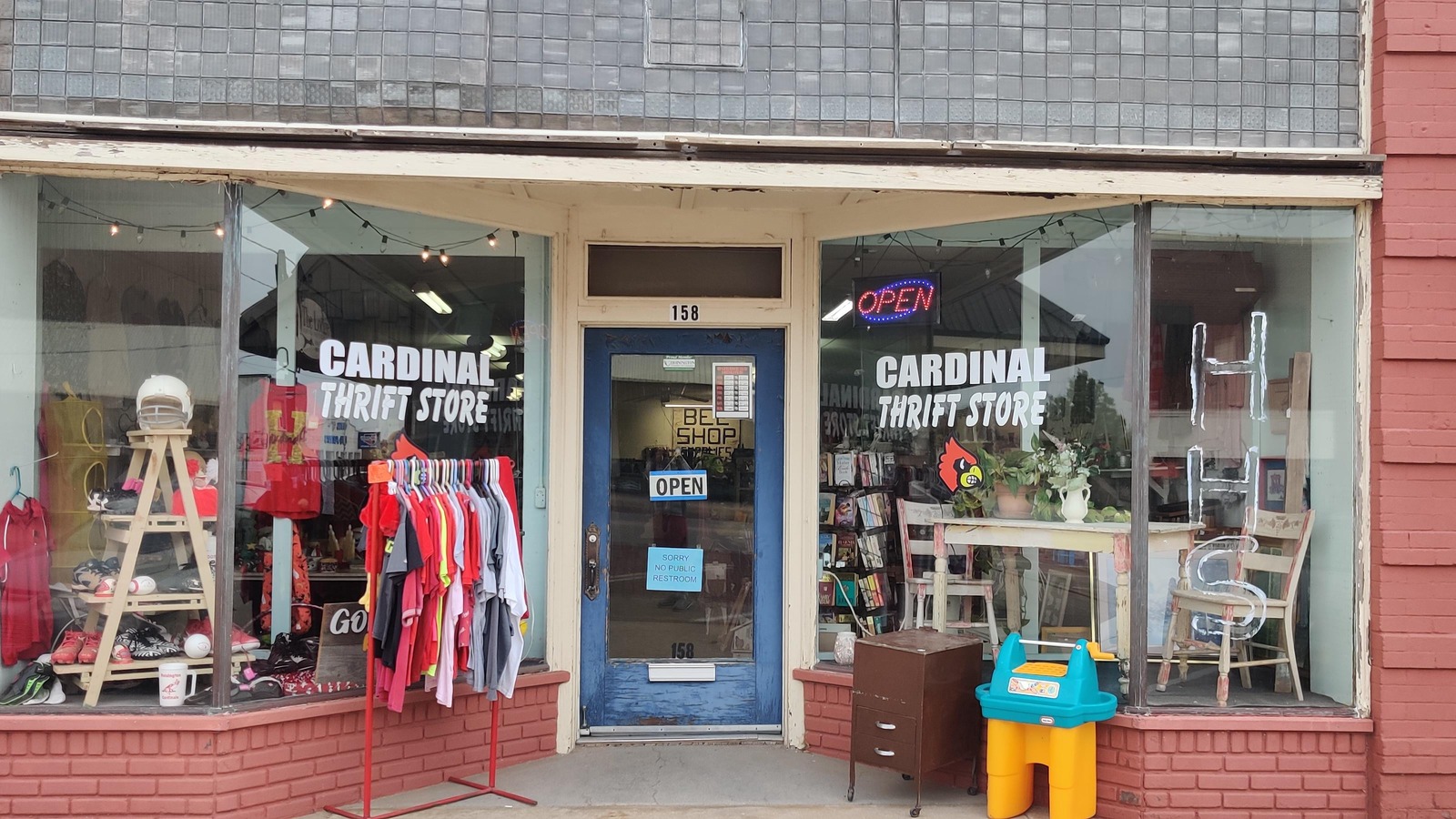 Cardinal Thrift Store storefront and clothing display in downtown Hoisington