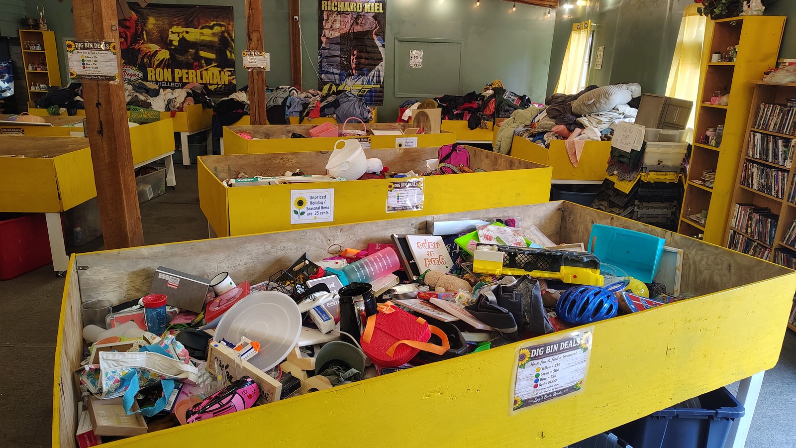 Yellow bargain bins filled with toys and household finds at Lay'd Back Resale in Morristown