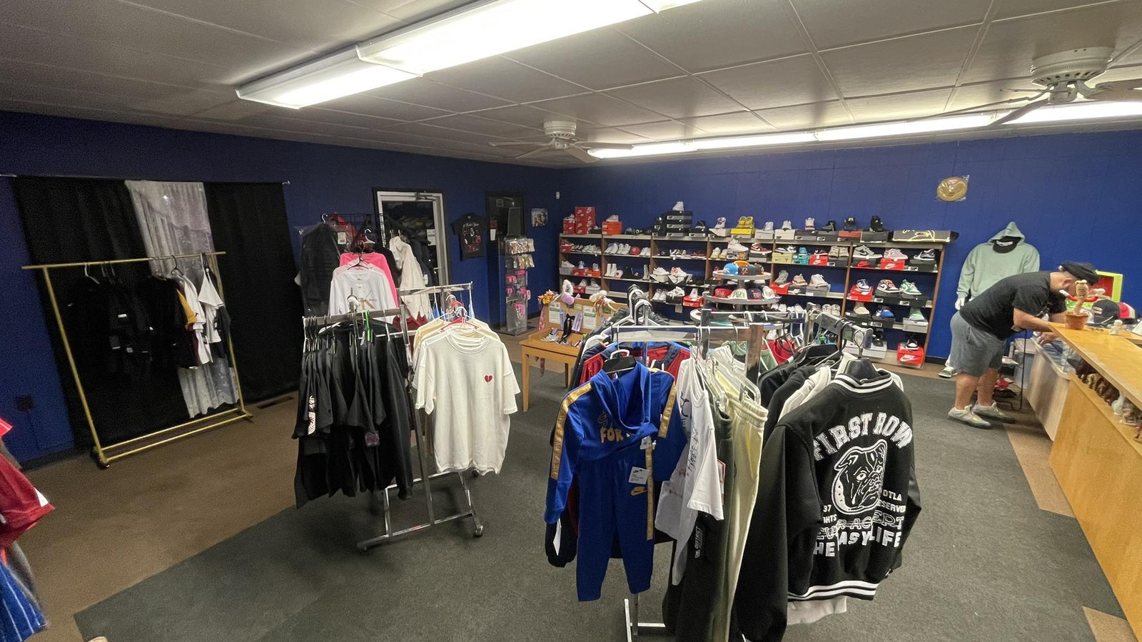 Clothing racks and shoe displays inside Rick's Resale Shop in Galesburg