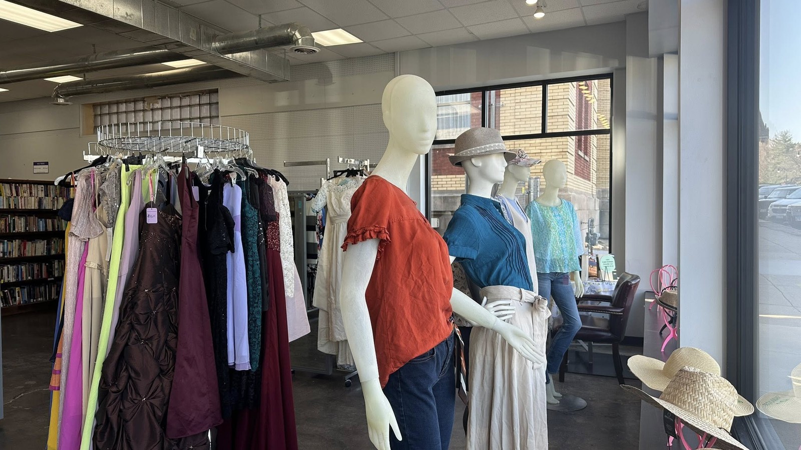 Clothing racks and dressed mannequins at Purple Hanger Shoppe in Galesburg