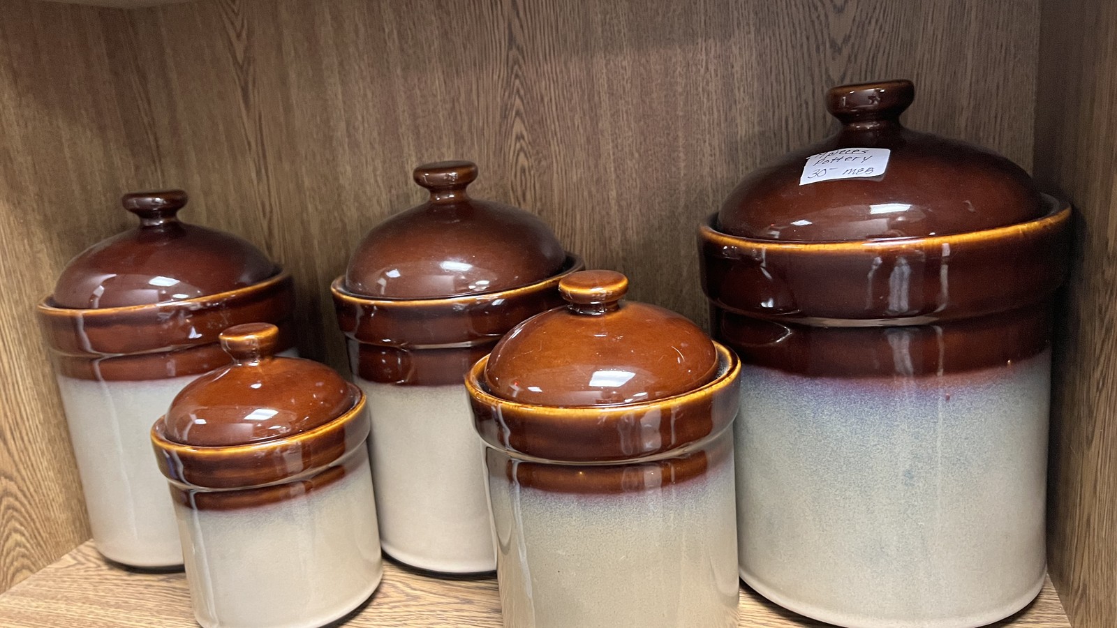 Vintage brown and cream ceramic crocks at The Junk Drawer in Galesburg