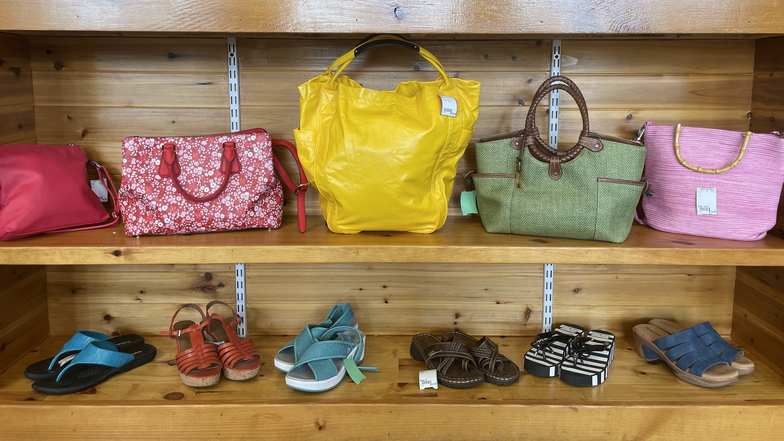 Colorful handbags and shoes displayed at Retail Therapy Consignment Boutique in Waterville