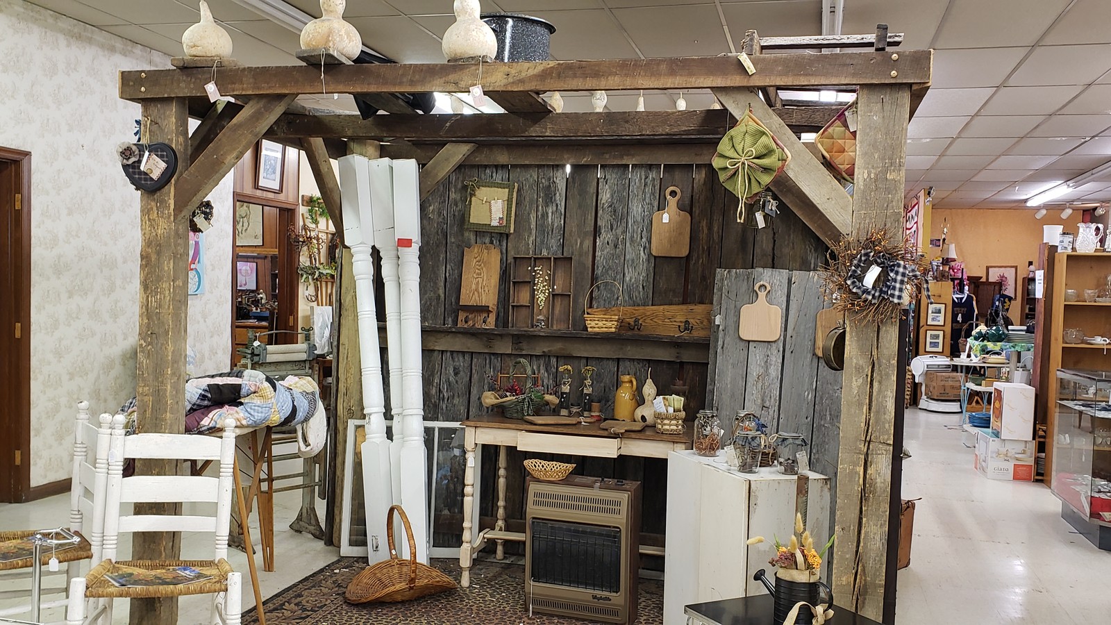 Rustic fireplace and primitive decor booth inside The Very Thing in Lewisburg