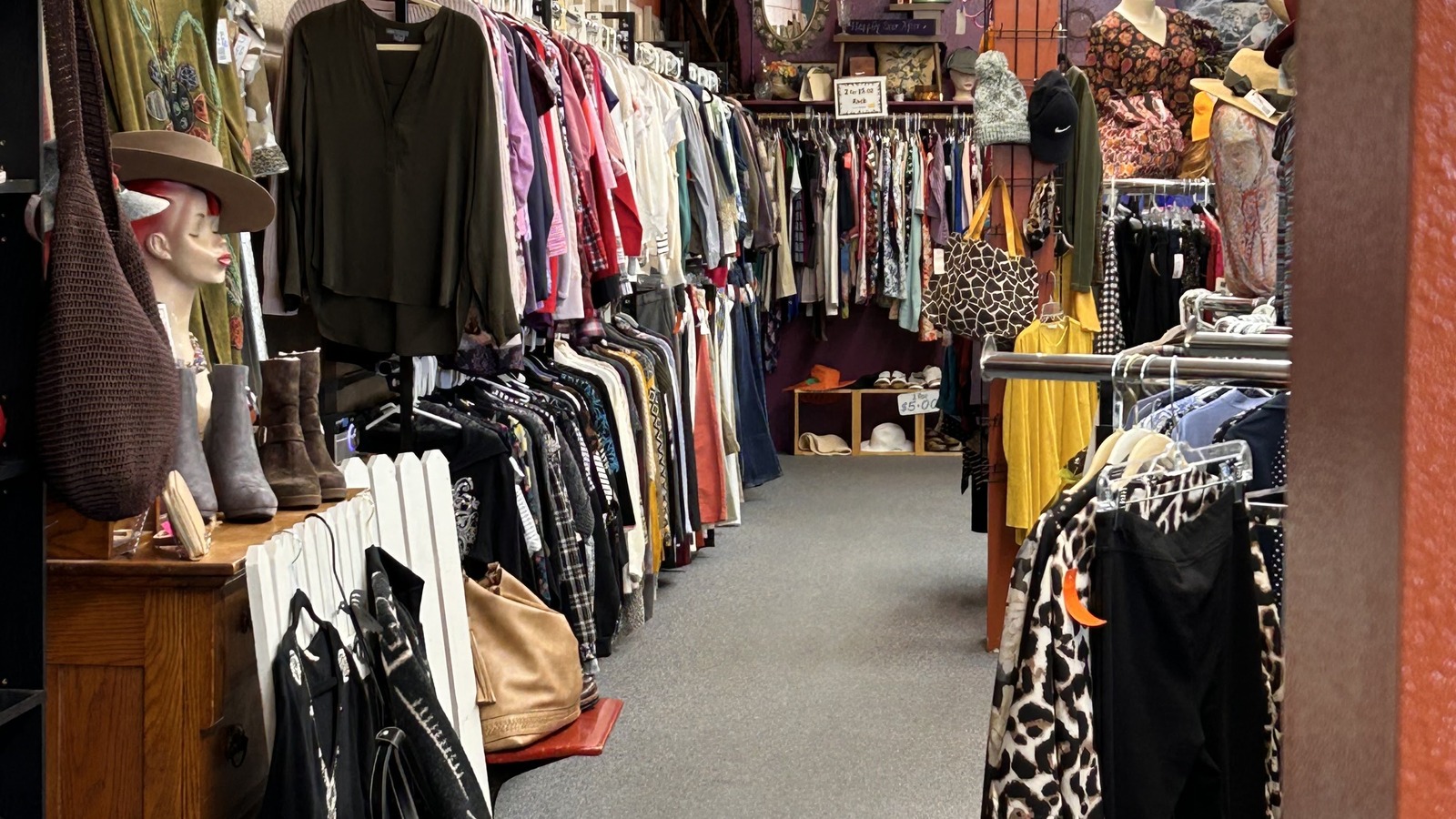 Clothing racks and accessories inside 2nd Hand Rose in Cody
