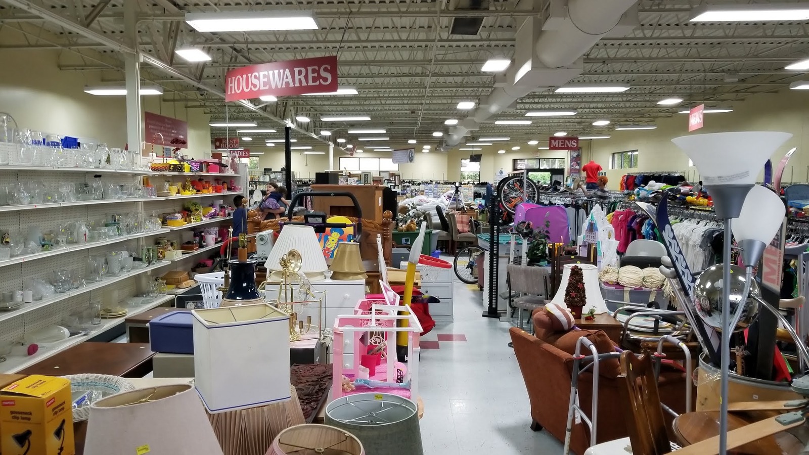 Housewares, clothing, and furniture aisles inside Triad Goodwill on Samet Drive in High Point