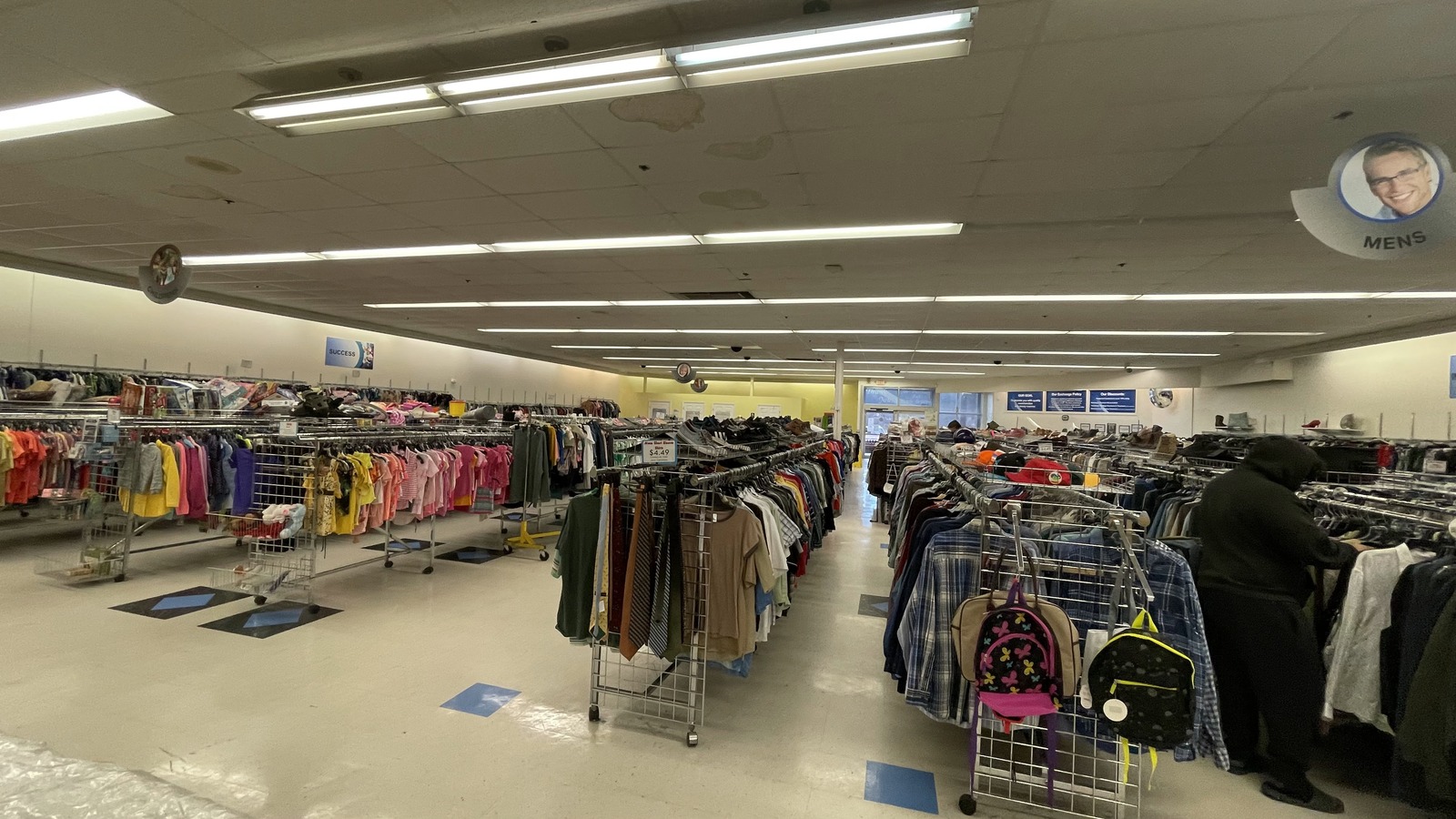 Long organized clothing aisles inside Triad Goodwill on West Wendover Avenue near High Point