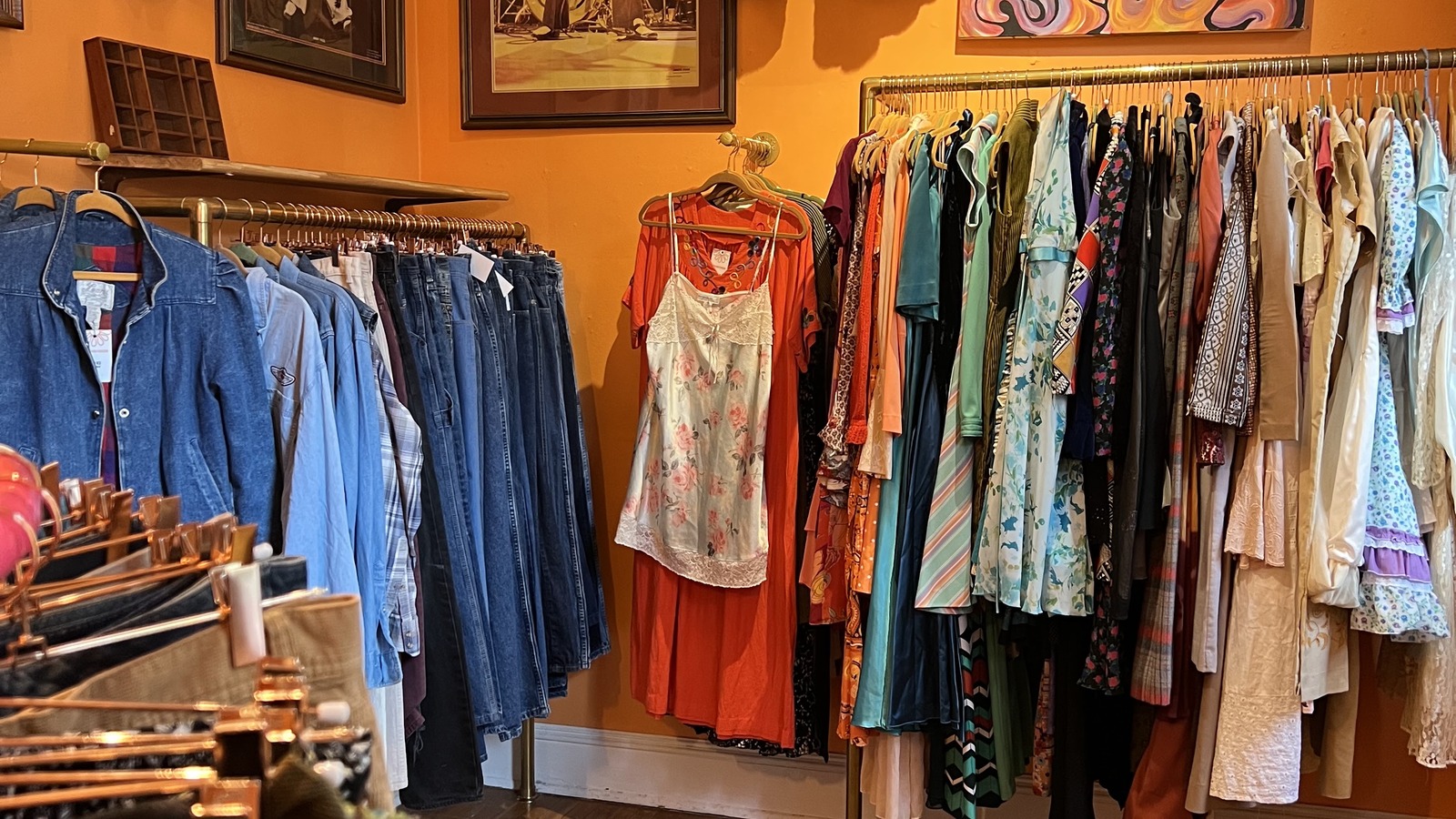 Vintage jackets, dresses, and colorful clothing racks inside Daisy Daydream in Southern Pines