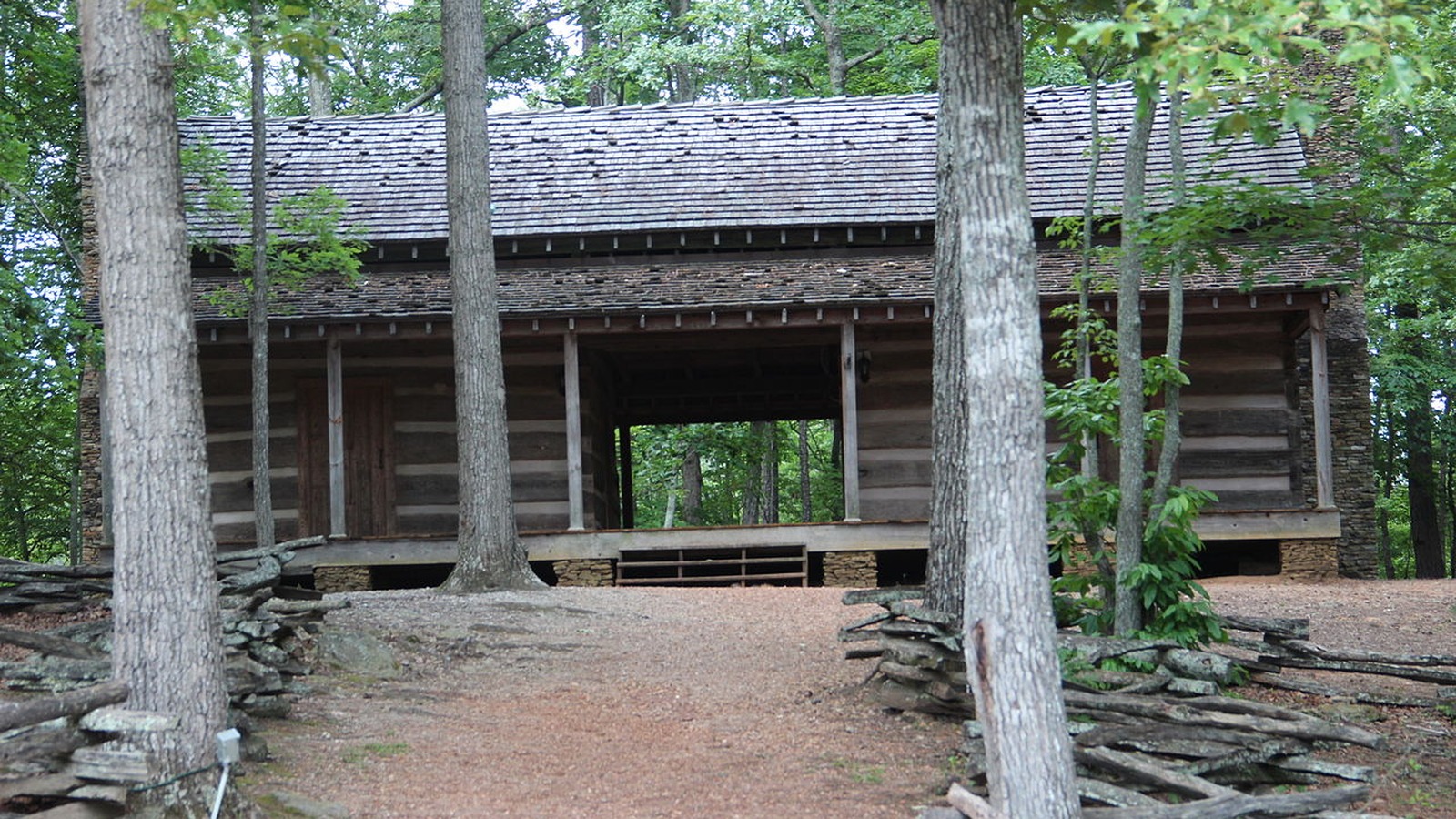 Historic cabin area tucked among the trees at Red Top Mountain State Park.