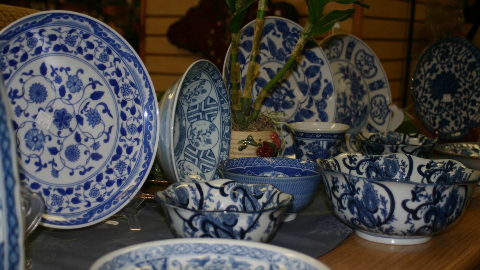 Blue-and-white dishes and decorative serving pieces at Centsible Furnishing near Belleview