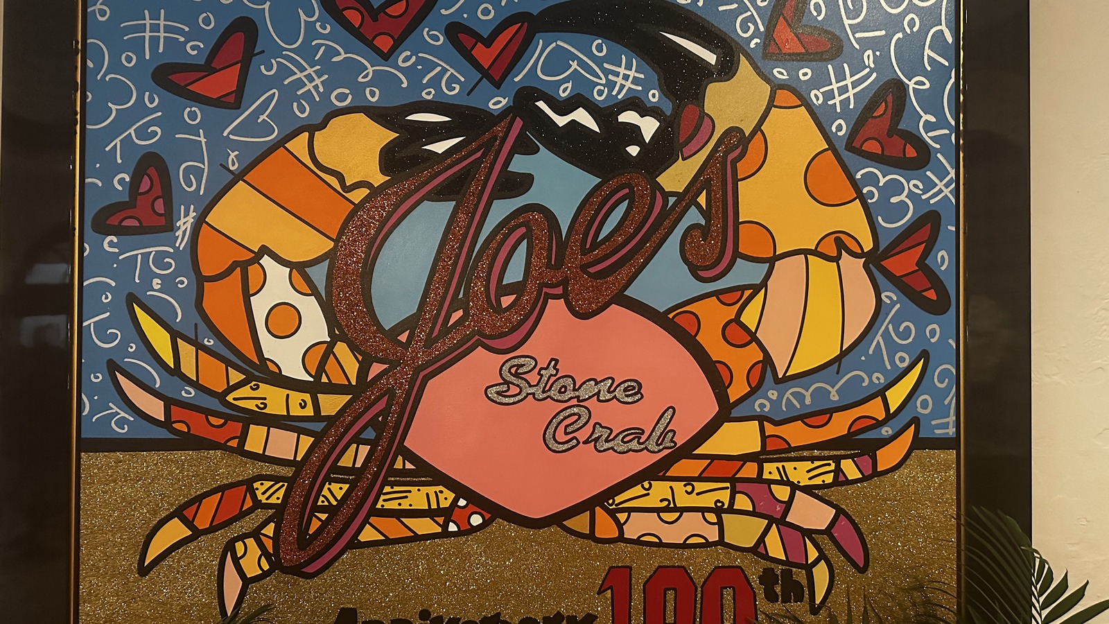 Joe's Stone Crab 100th anniversary artwork inside the Miami Beach restaurant