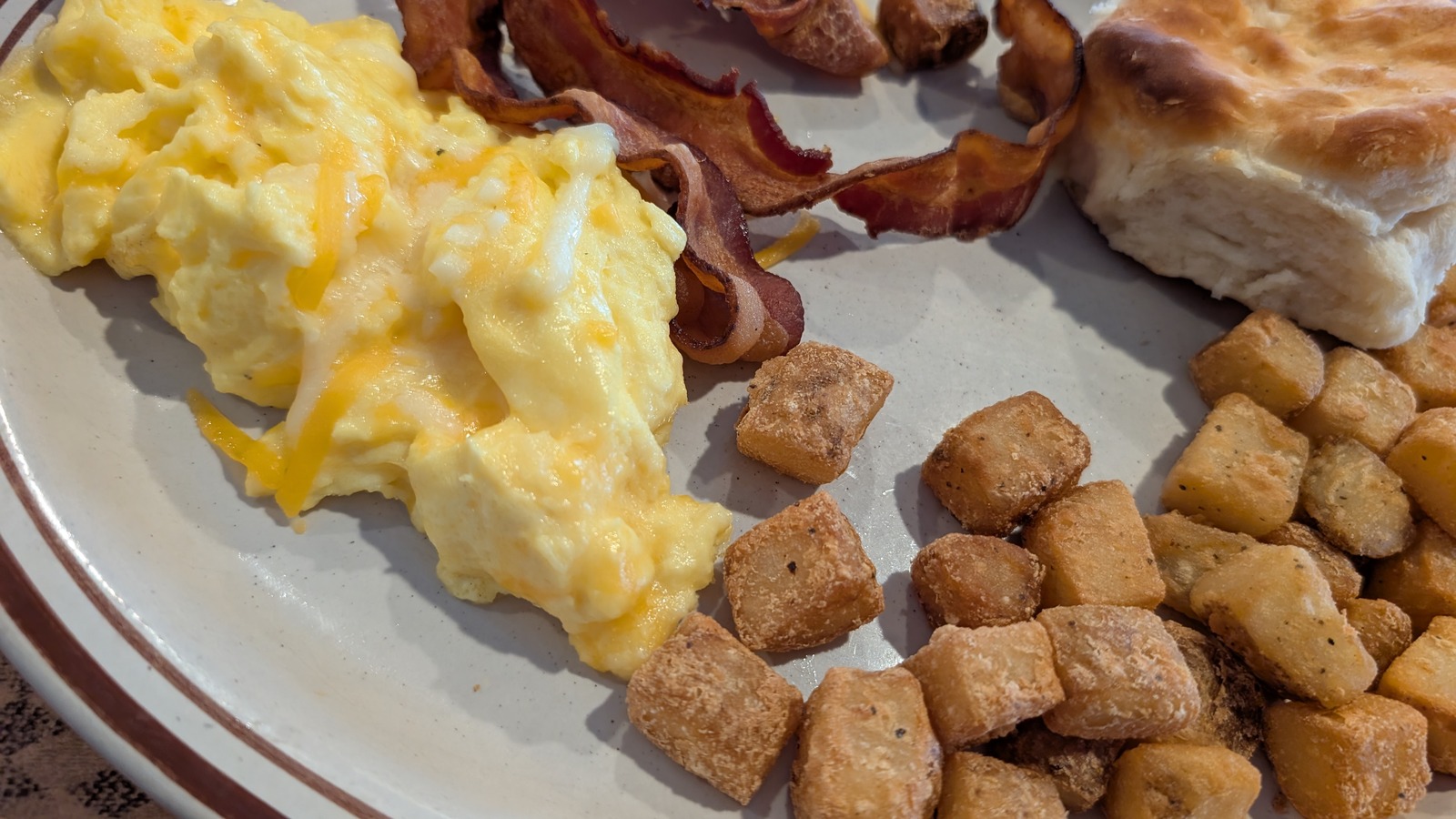 Scrambled eggs, bacon, biscuit, and home fries at Trish's Mountain Diner in Gatlinburg
