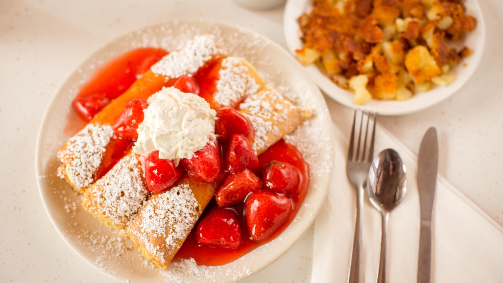 Strawberry-topped crepes with powdered sugar at The Pancake Pantry in Nashville