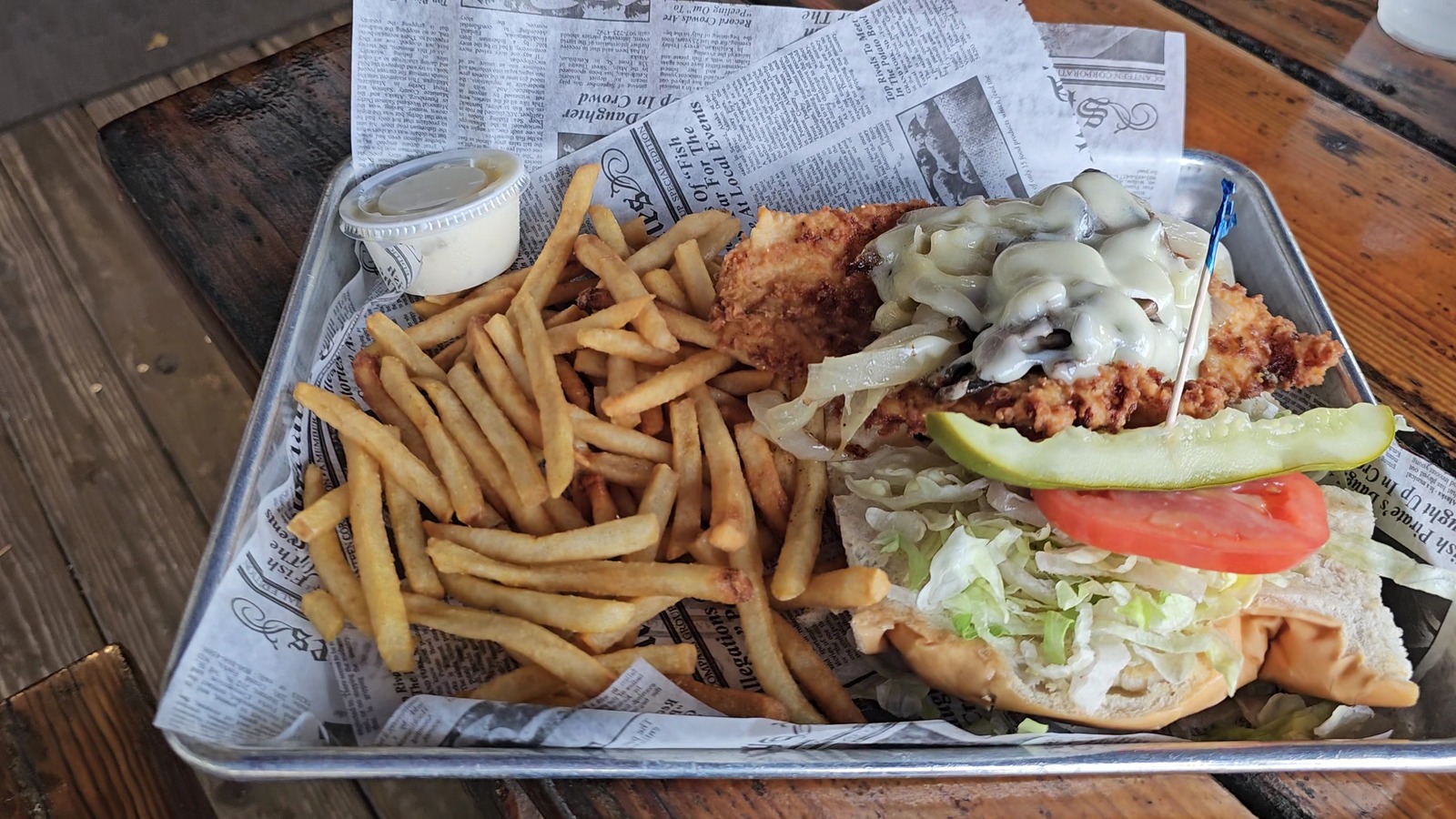 Hogfish sandwich with Swiss cheese, onions, mushrooms, and fries at Hogfish Bar & Grill