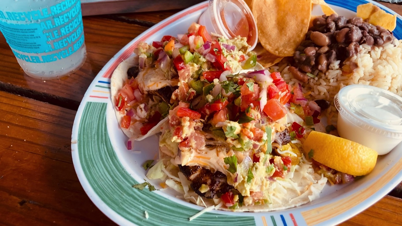 Blackened hogfish tacos with rice, beans, chips, and pico de gallo at Hogfish Bar & Grill