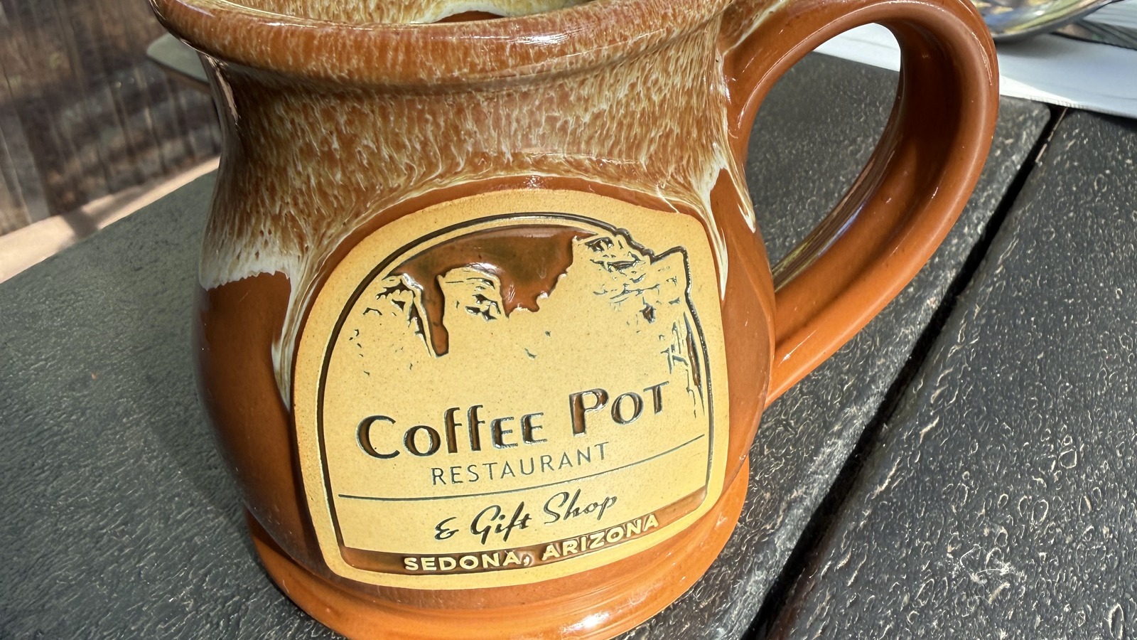 Stoneware Coffee Pot Restaurant mug on a patio table in Sedona