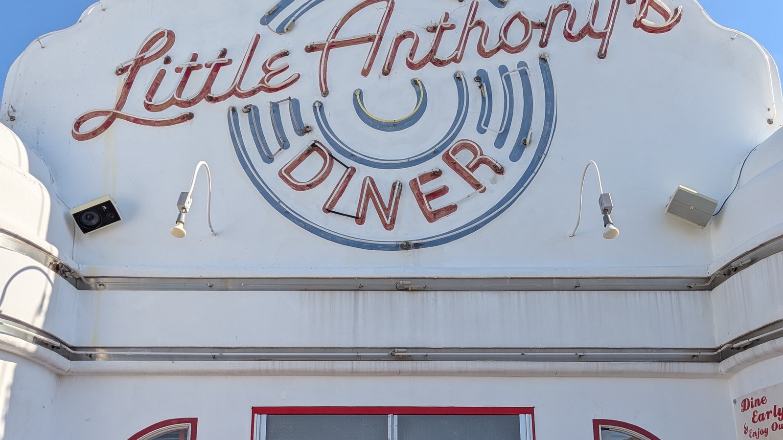 Front doors and Little Anthony's Diner sign above the checkerboard entry