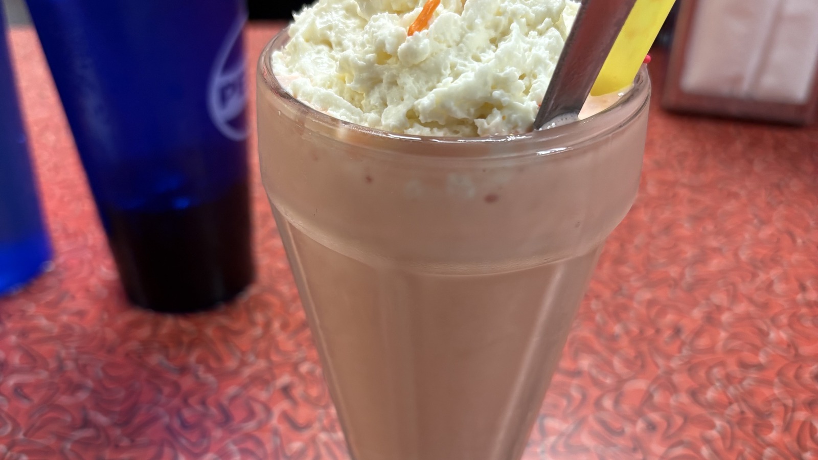 Chocolate milkshake topped with whipped cream at Little Anthony's Diner