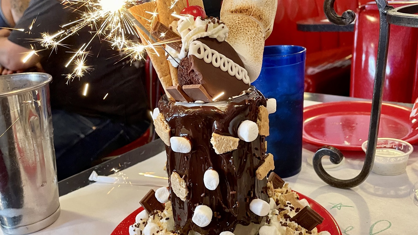 Towering s'mores sundae with a sparkler at Little Anthony's Diner