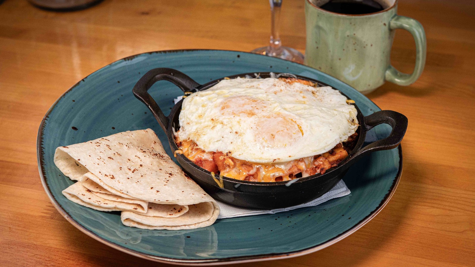 Skillet breakfast with tortillas, coffee, and orange juice at T.C. Eggington's