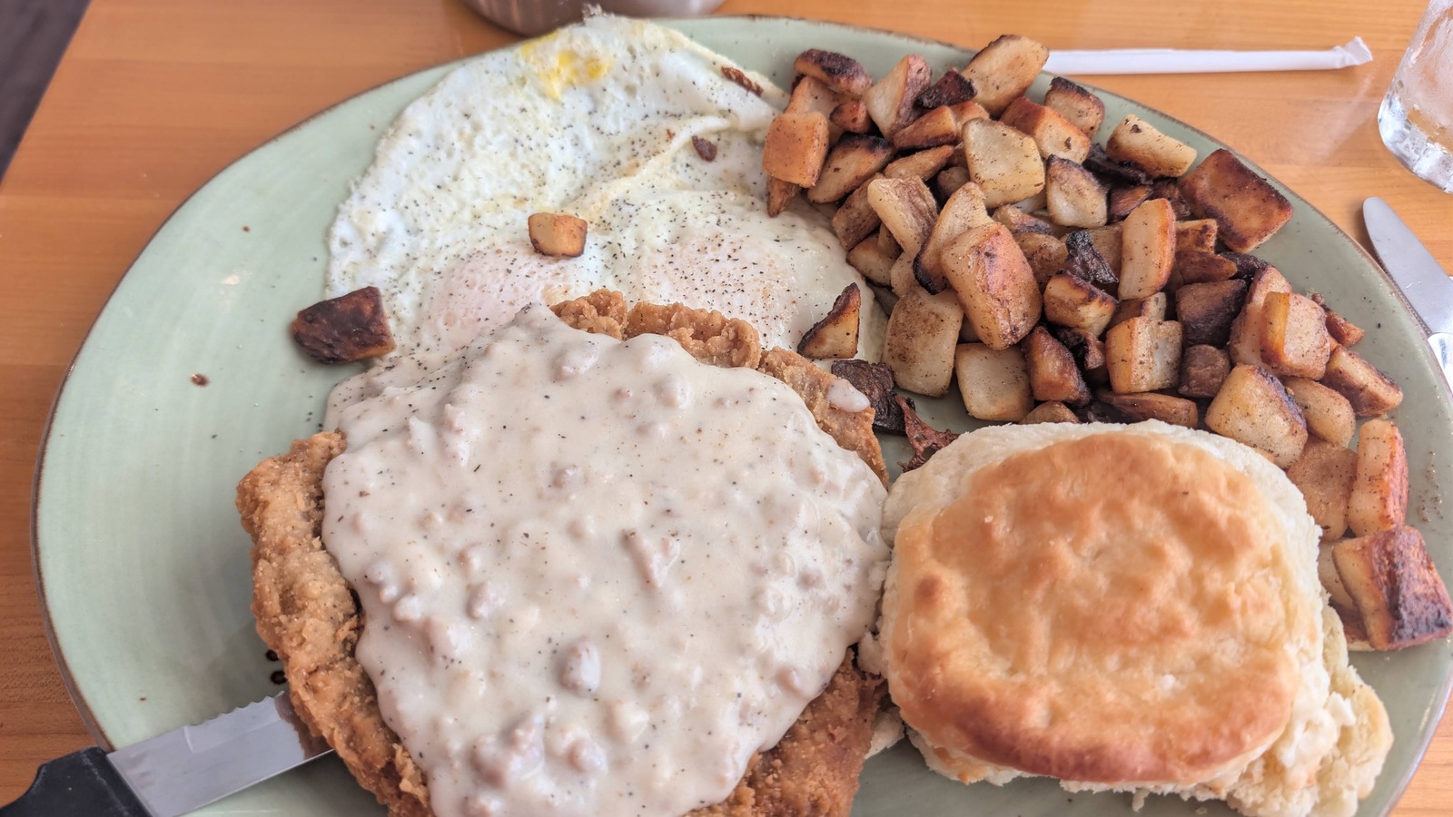 Country-fried steak breakfast with eggs, biscuit, and home fries at T.C. Eggington's