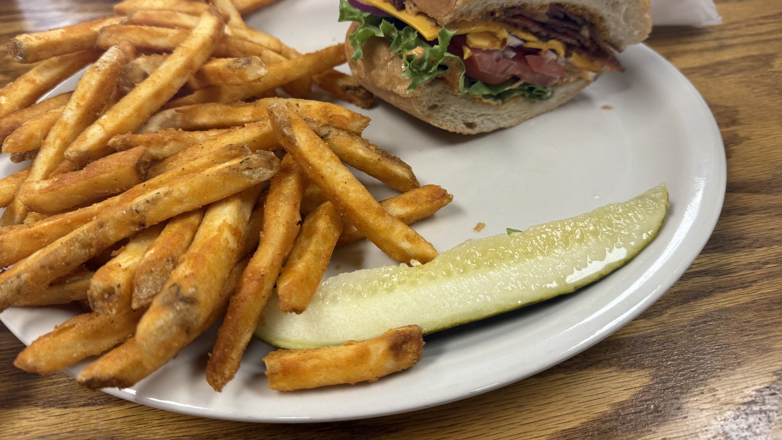 Burger basket with seasoned fries at Zeke's Eatin' Place