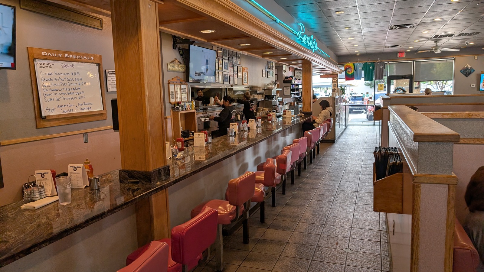 Long diner counter with pink stools inside Randy's Restaurant & Ice Cream in Scottsdale