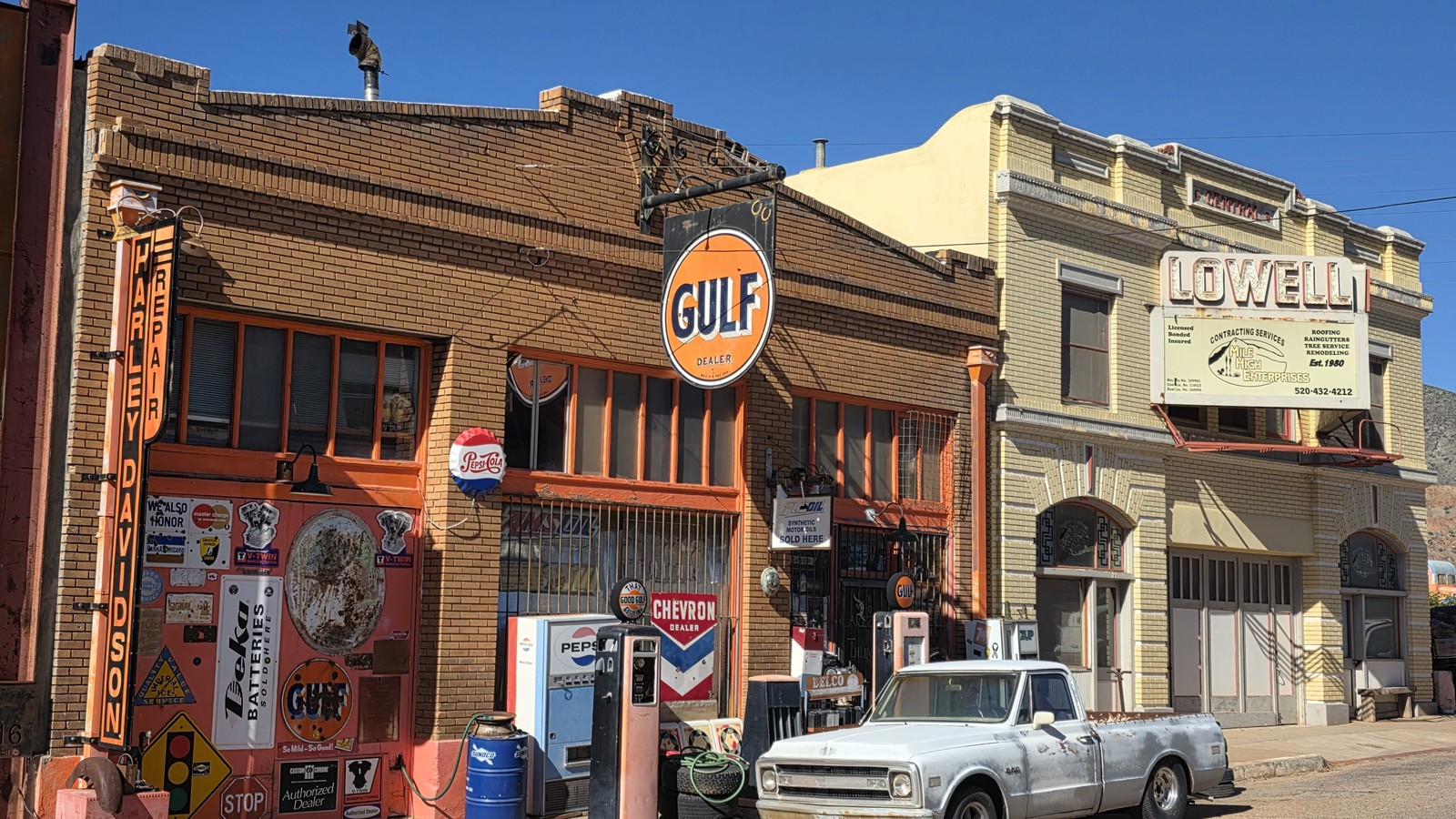Lowell storefronts with a vintage Gulf sign near Bisbee Breakfast Club