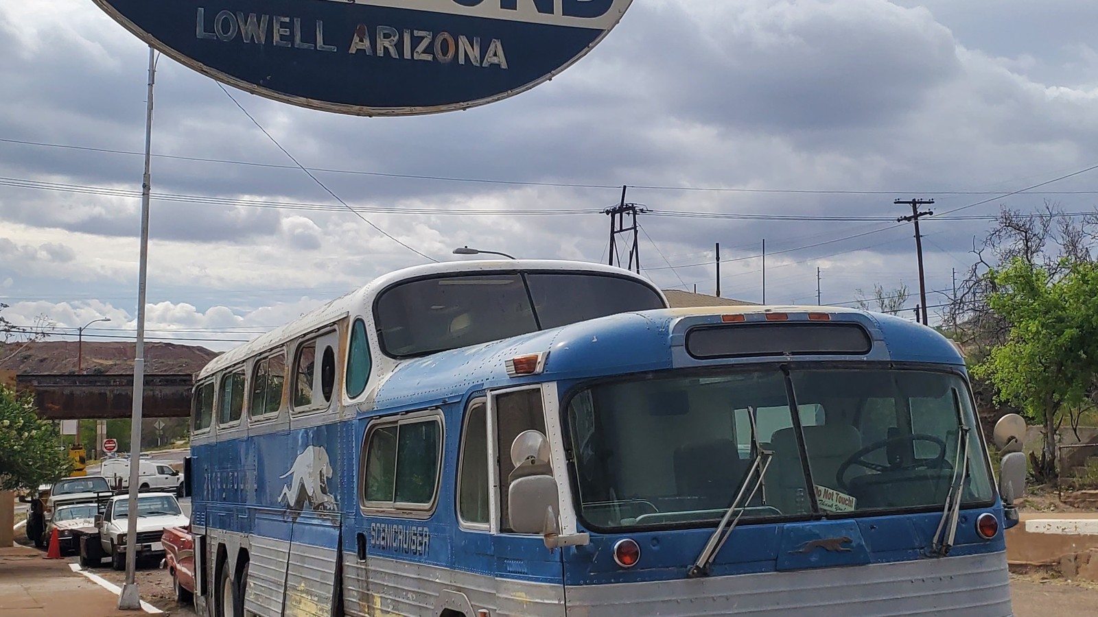 Vintage Greyhound sign and blue bus in Lowell near Bisbee Breakfast Club