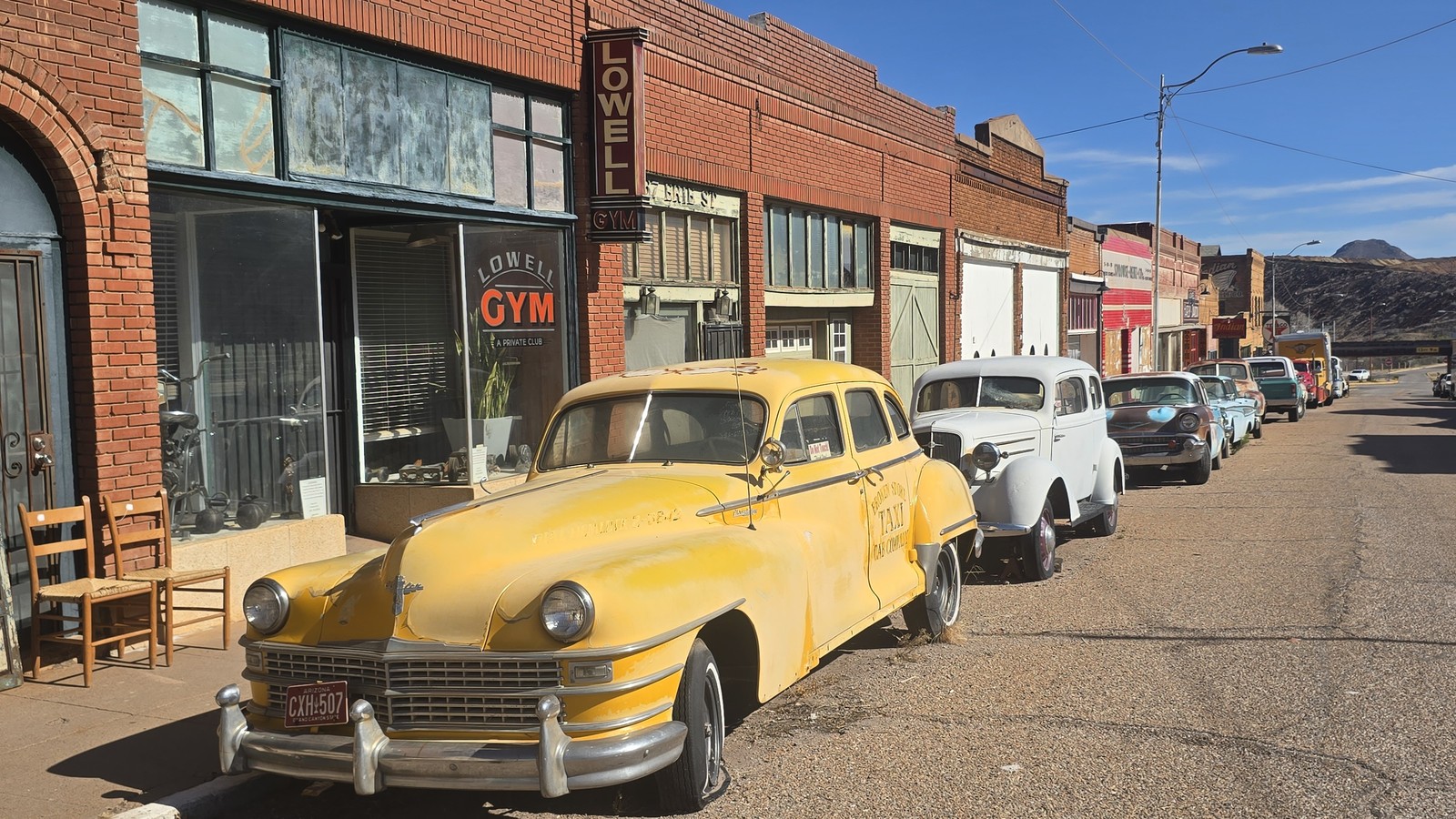 Classic cars lined up along Erie Street in Lowell outside Bisbee Breakfast Club
