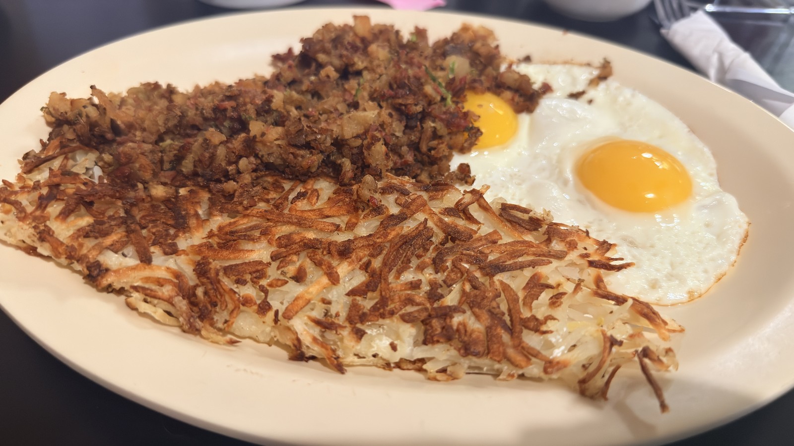 Eggs, crisp hashbrowns, and a house breakfast patty at Bisbee Breakfast Club