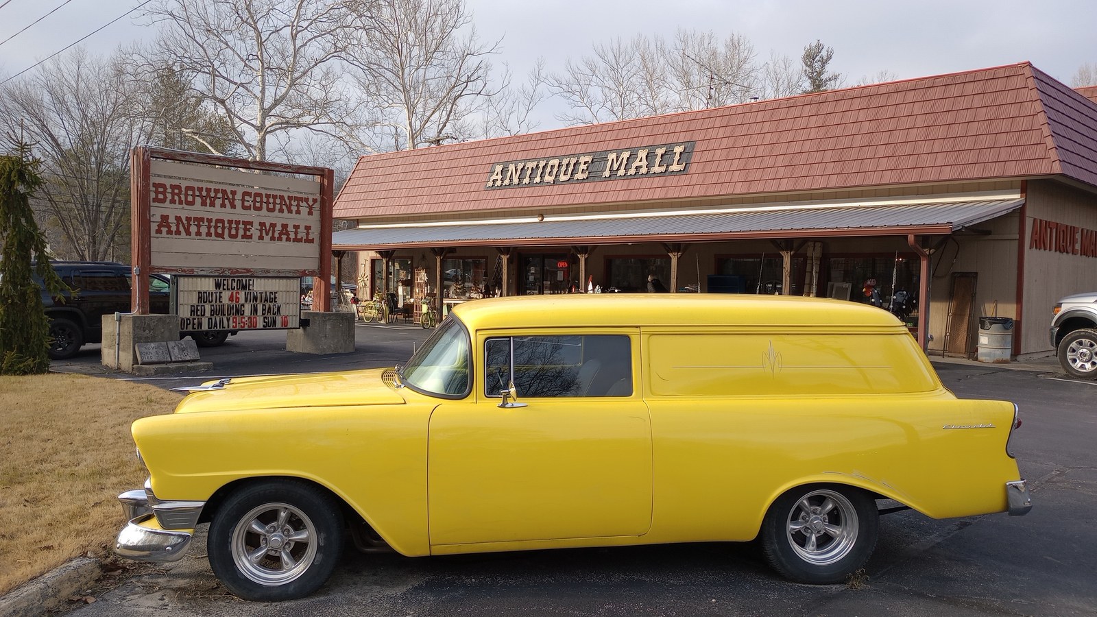 Bright yellow classic panel wagon parked outside Brown County Antique Mall in Nashville