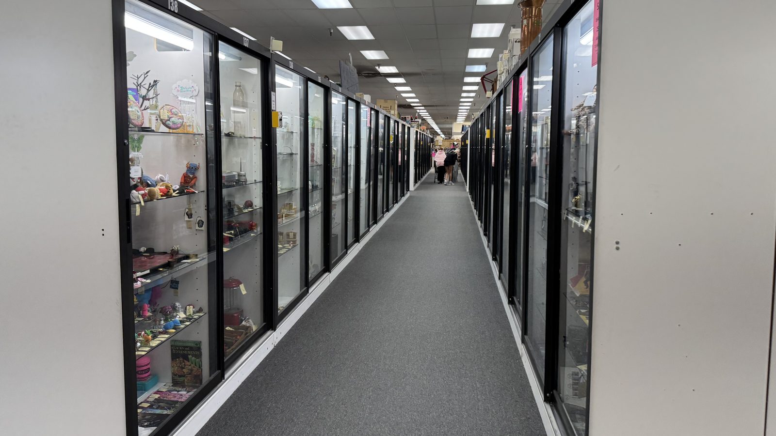 Long glass-case corridor inside Ohio Valley Antique Mall