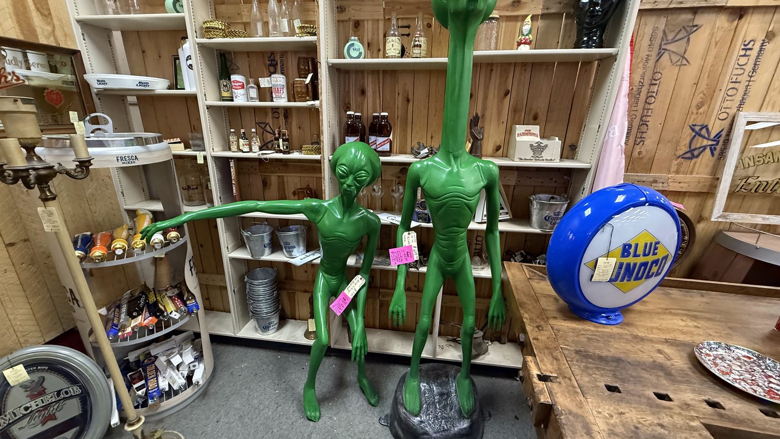 Green alien figure and quirky collectibles inside Ohio Valley Antique Mall