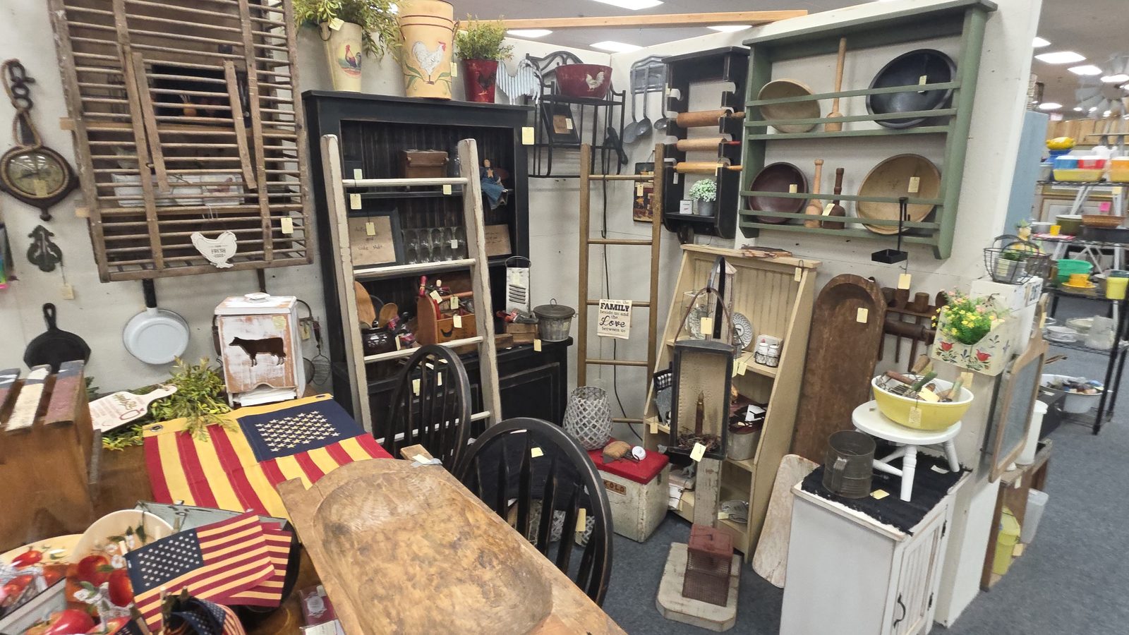 Farmhouse furniture and kitchenware booth inside Ohio Valley Antique Mall
