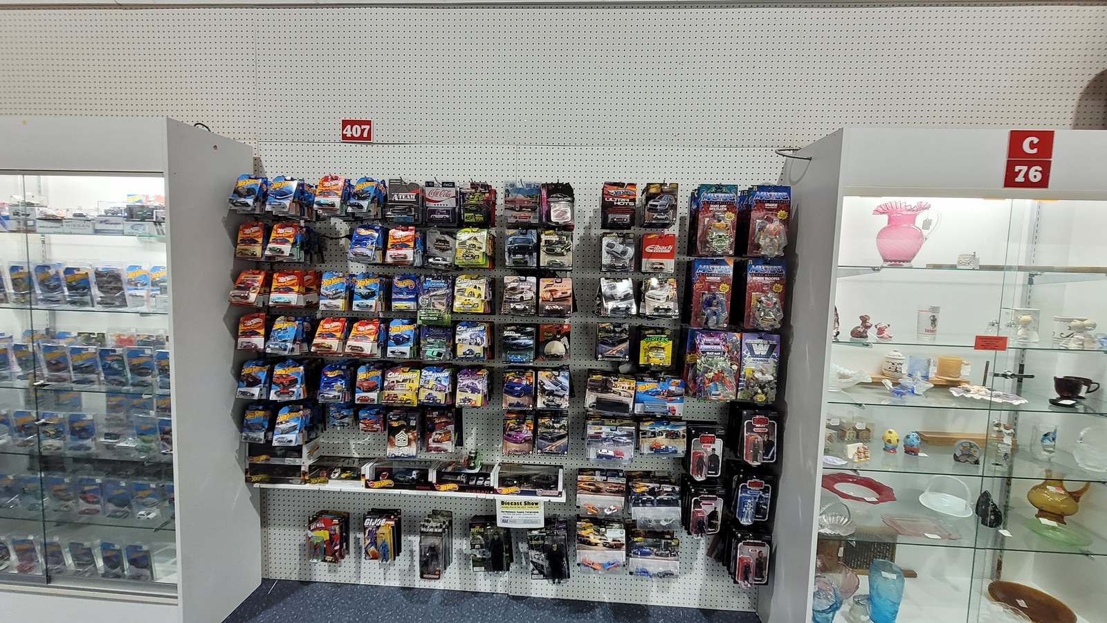 Wall of carded die-cast cars and collectible toys inside Exit 76 Antique Mall