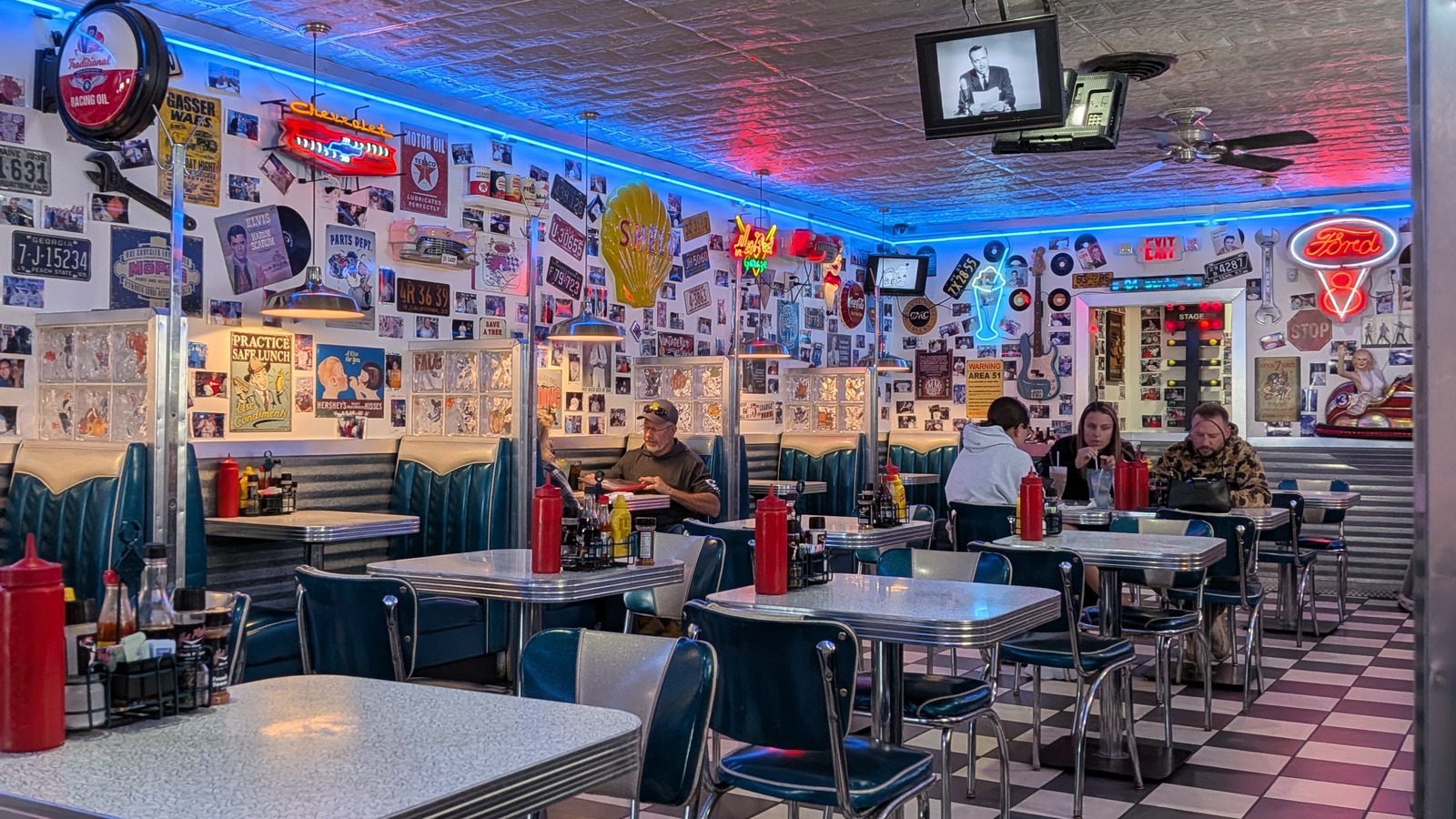 Checkerboard floor and chrome-trimmed booths inside Hot Rods 50's Diner