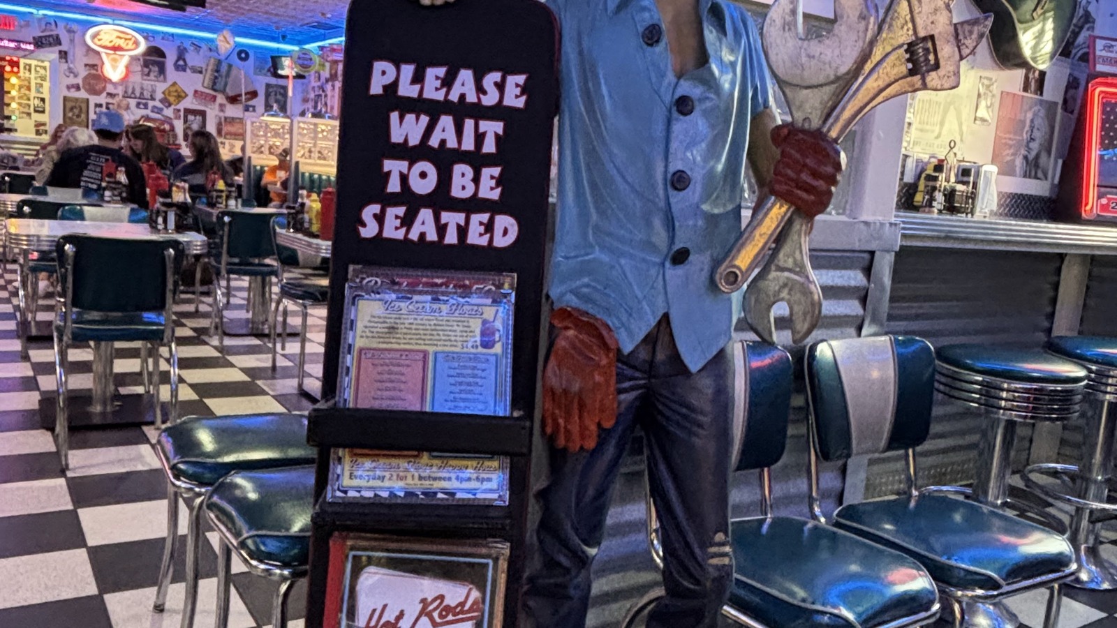 Mechanic statue greeting diners inside Hot Rods 50's Diner