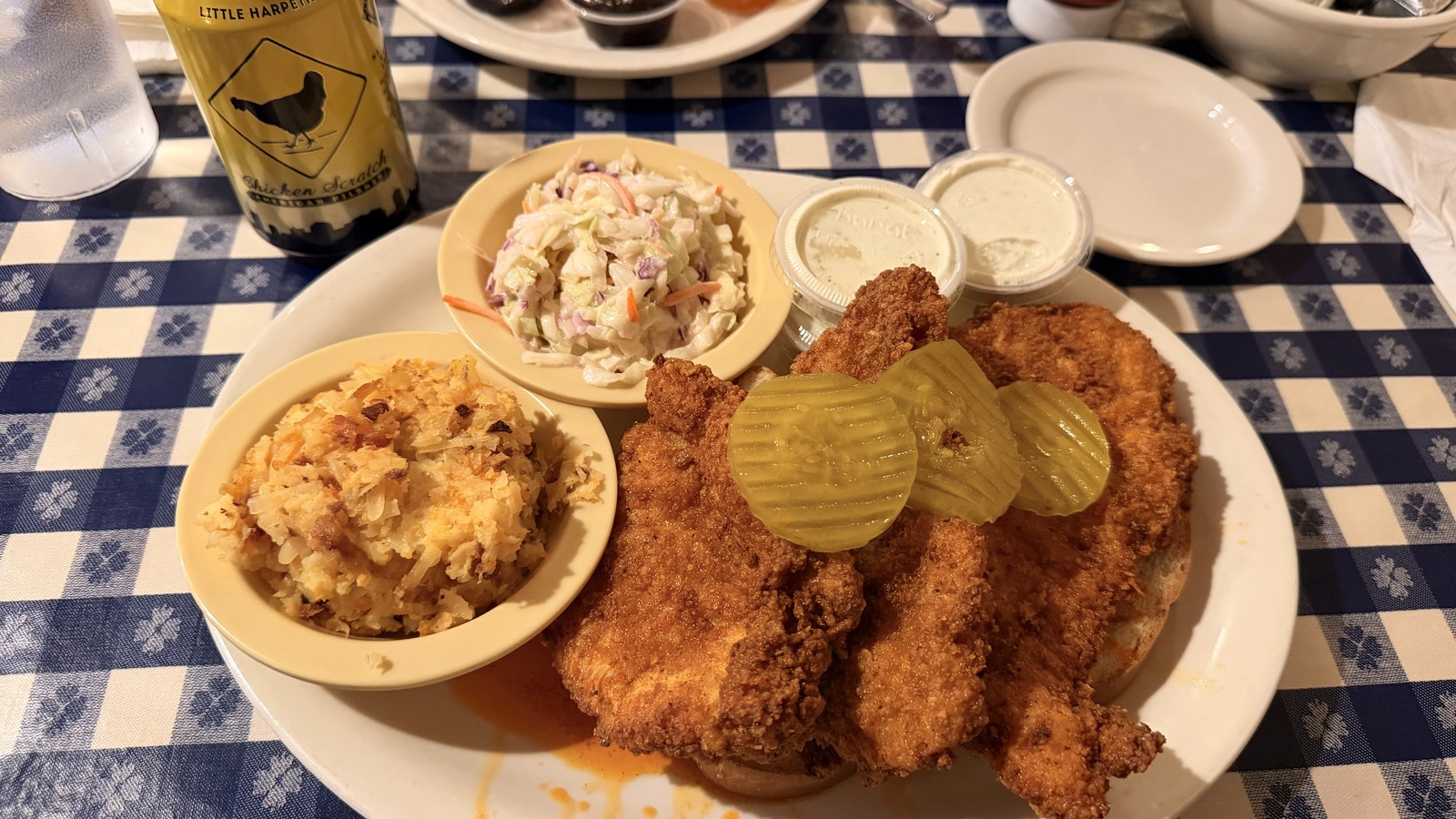 Fried chicken plate with hashbrown casserole, slaw, and pickles at The Loveless Cafe