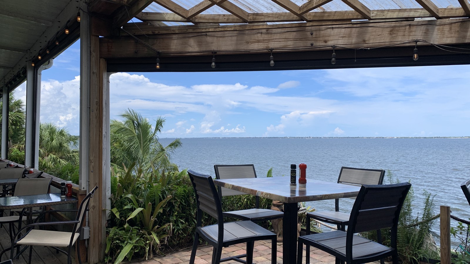 Covered deck table looking straight across the Indian River at The Shack in Palm Bay