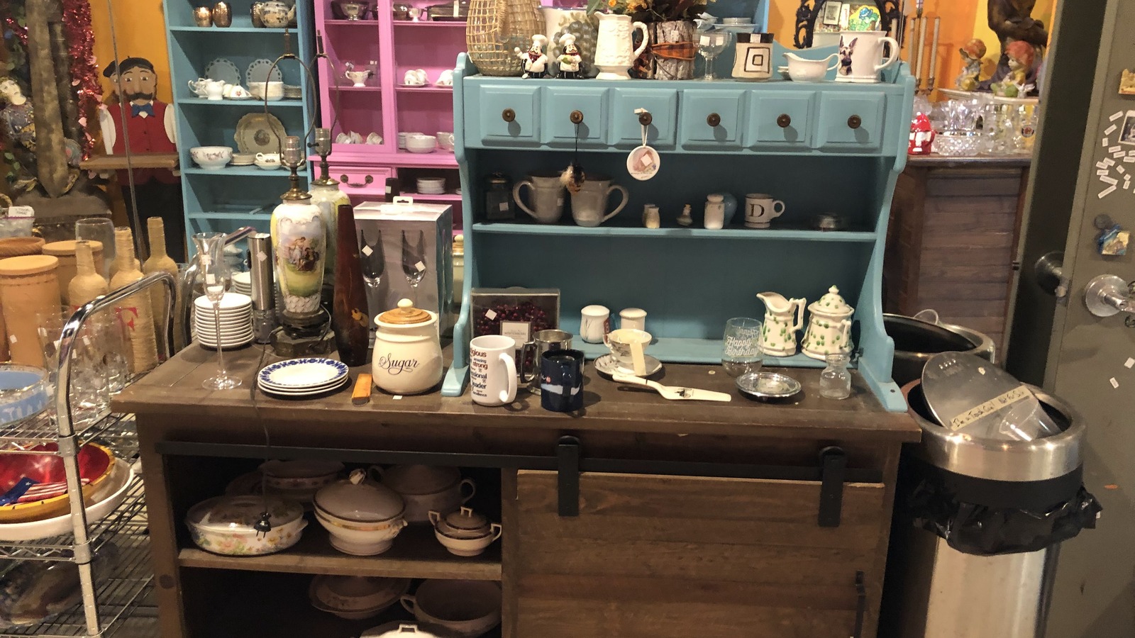 Shelves of ceramics, vases, and home decor at Philly AIDS Thrift in Philadelphia