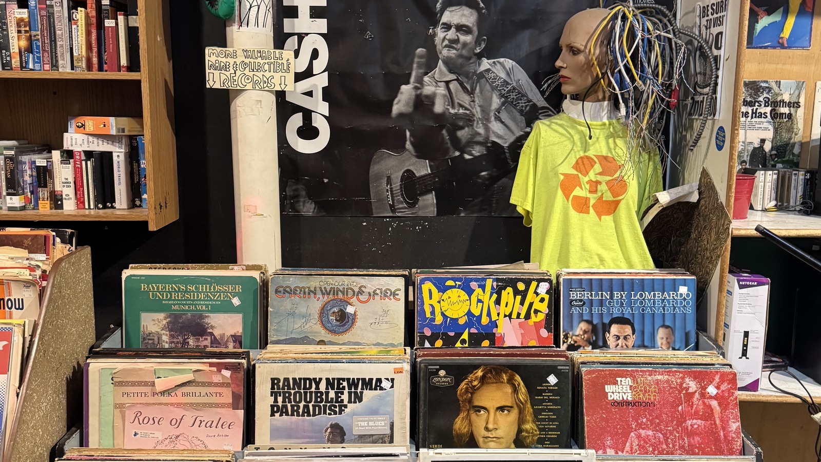Record bins, books, and a large wreath inside Philly AIDS Thrift in Philadelphia