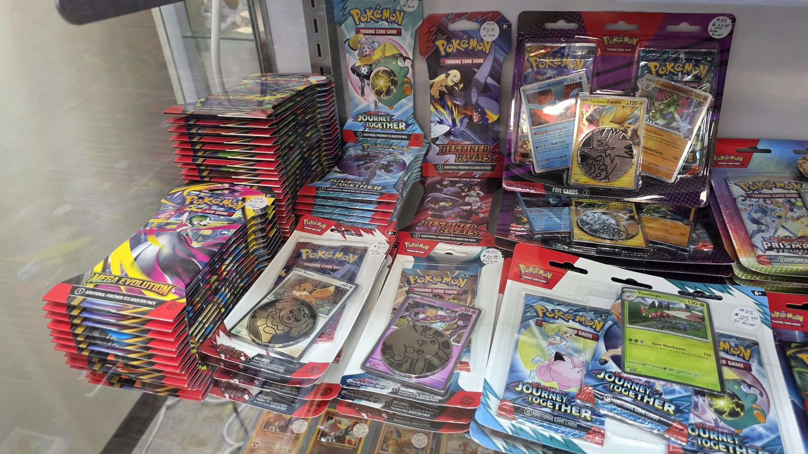 Collector case filled with trading cards and sealed packs at Vintage Treasures Antique Mall in Fort Wayne
