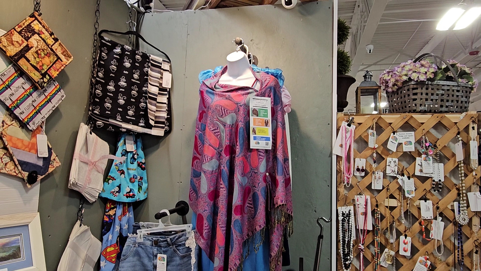 Boutique-style corner with accessories, jewelry, and a colorful wrap at America's Antique Mall in Highland