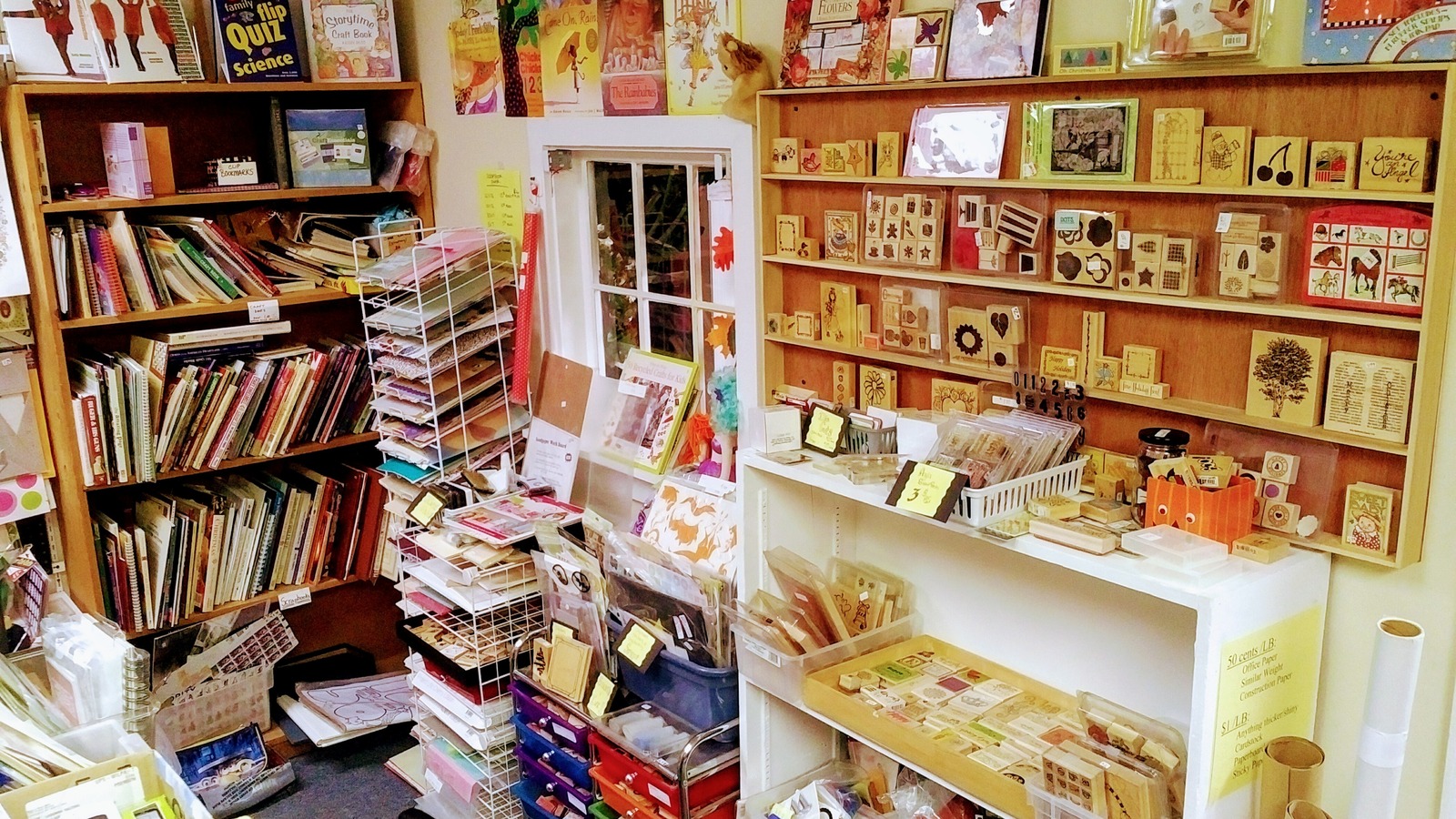 Rubber stamps, craft books, and paper supplies gathered in one corner at Lancaster Creative Reuse.