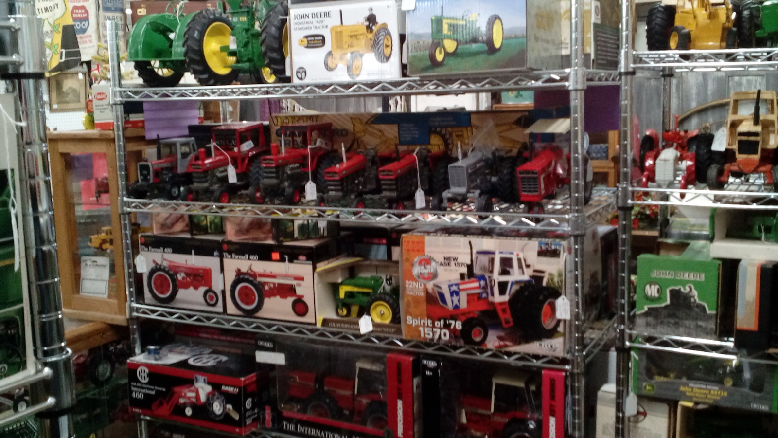 Shelves packed with model tractors and farm collectibles inside Markle Exit 286 Antique Mall