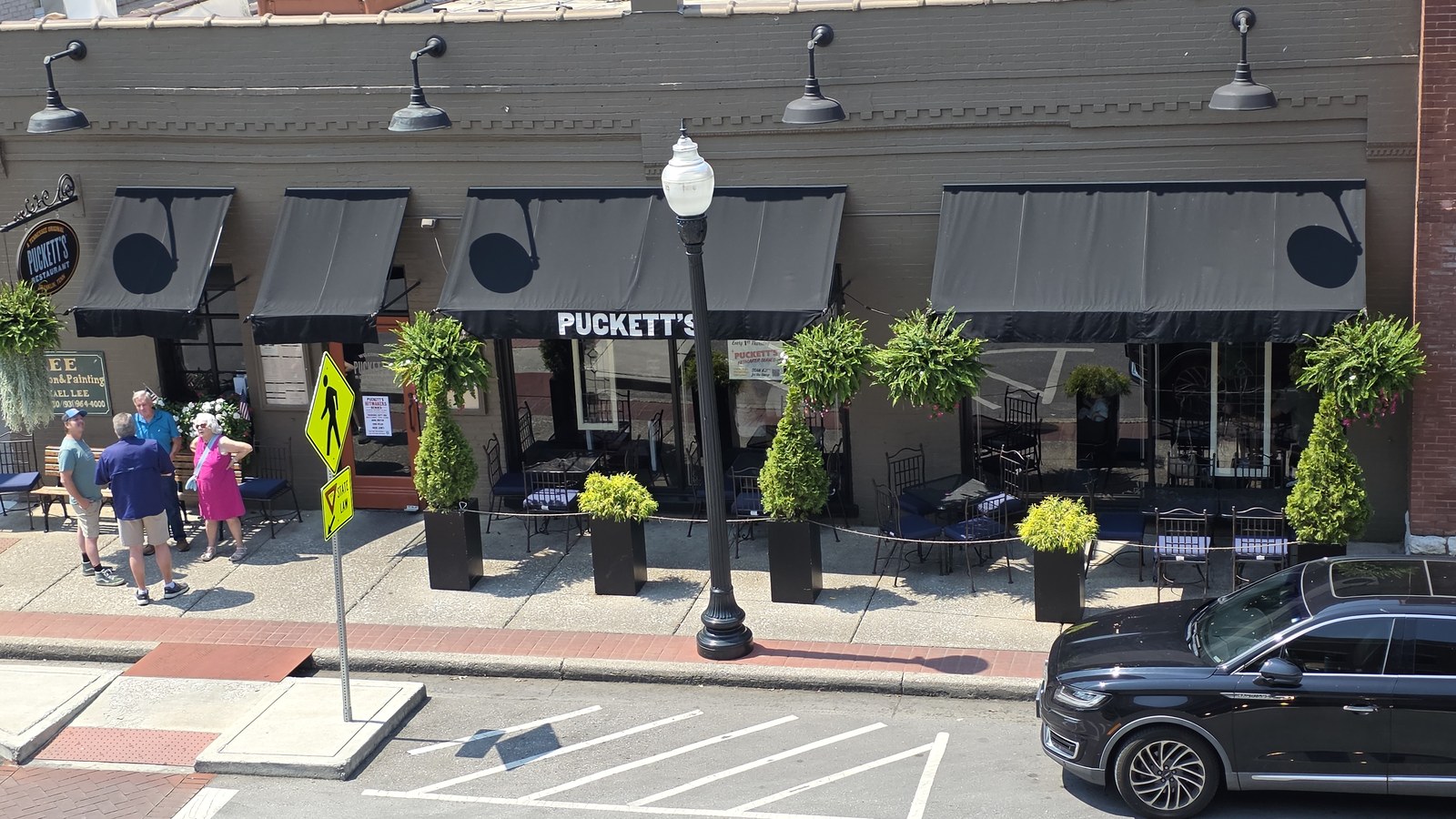 Puckett's Restaurant storefront and sidewalk seating on Fourth Avenue South in downtown Franklin