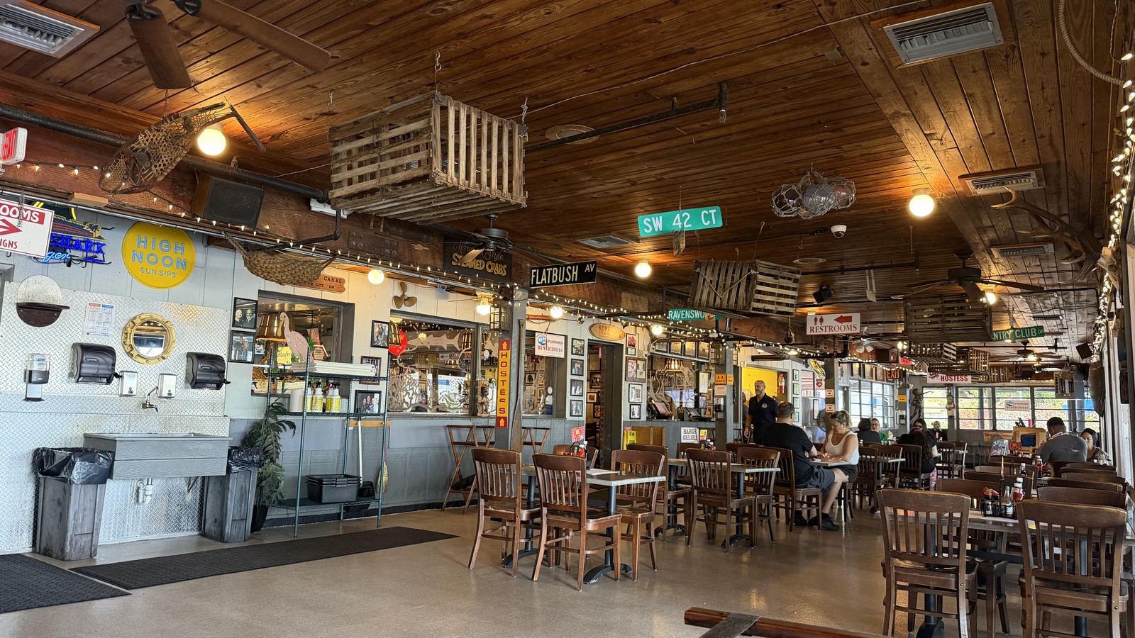 Wood-ceiling dining room inside Rustic Inn Crabhouse in Fort Lauderdale