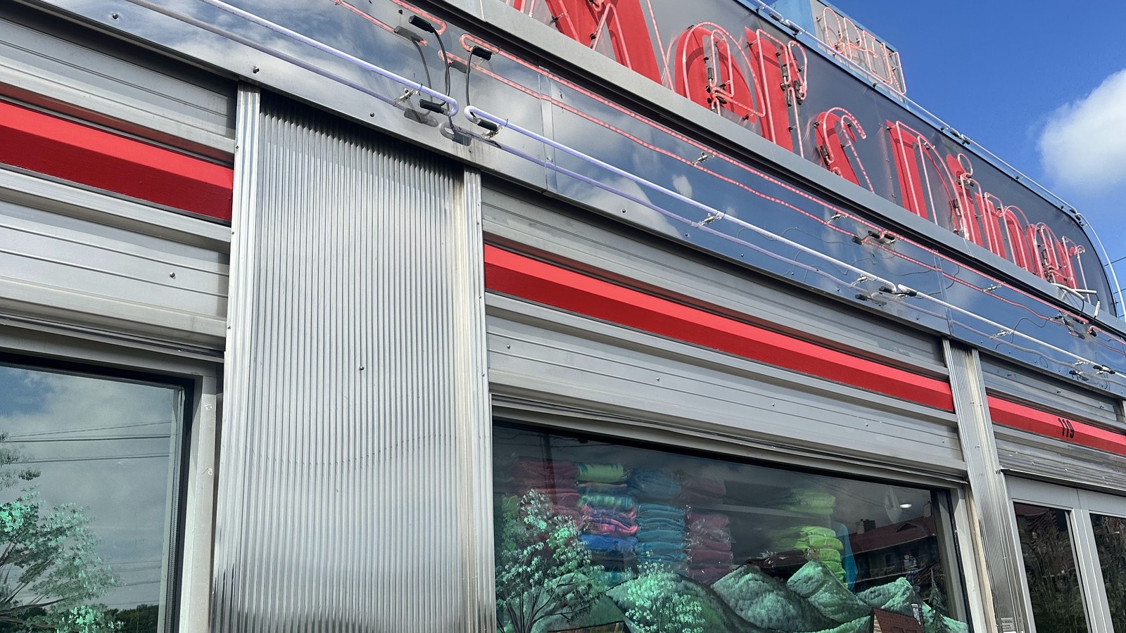 Mel's Diner neon sign above the stainless-steel exterior in Pigeon Forge