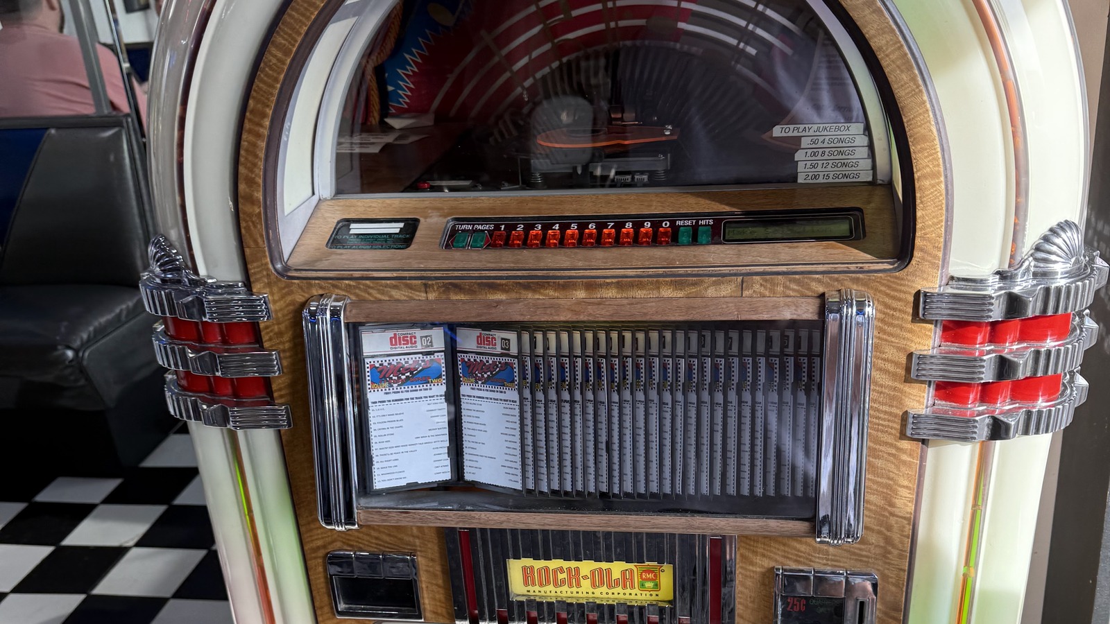 Classic jukebox standing on the checkerboard floor at Mel's Classic Diner